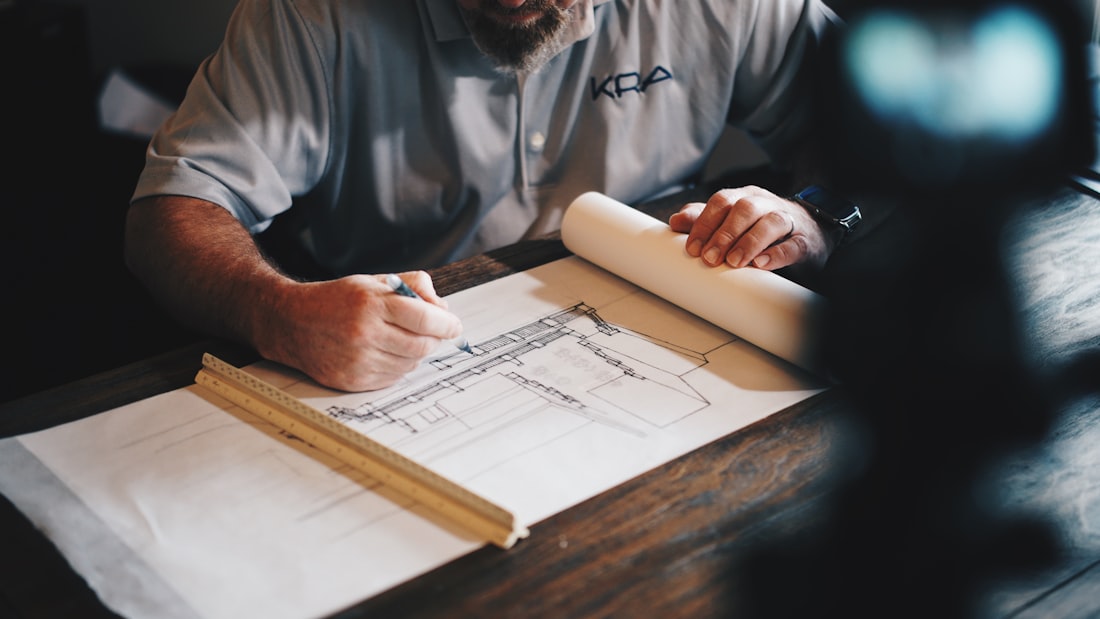 Architect reviewing technical drawings